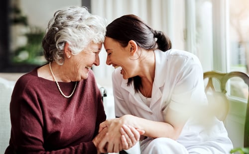 GettyImages-1076489562 nurse and senior woman smiling